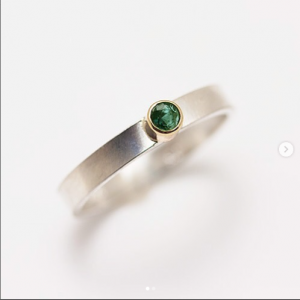 Matte sterling silver ring bears a 3mm