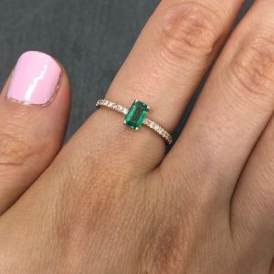 0.6 carat Emerald Cut Emerald and cubic zirconia