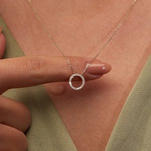 Circular hallo pendant with cubic zirconia all round set on 18 karat gold chain