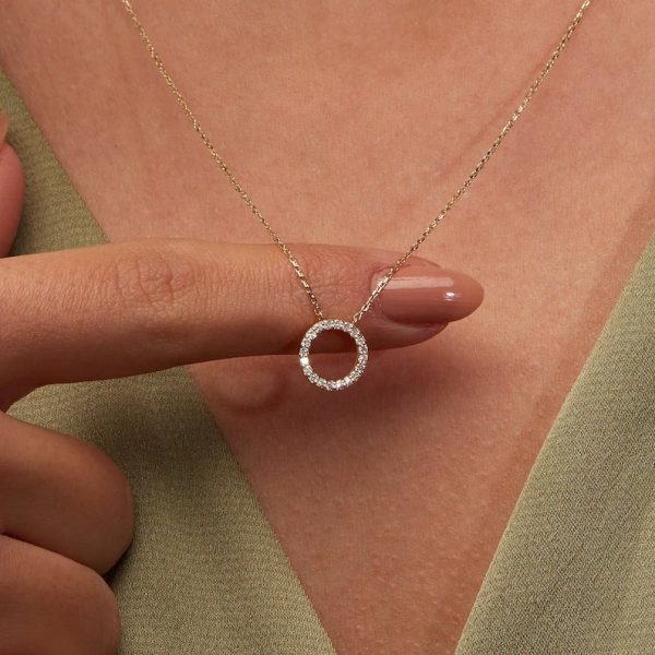 Circular hallo pendant with cubic zirconia all round set on 18 karat gold chain