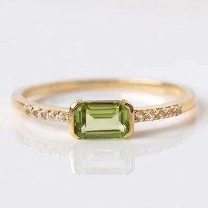 Peridot engagement ring on 18 karat gold