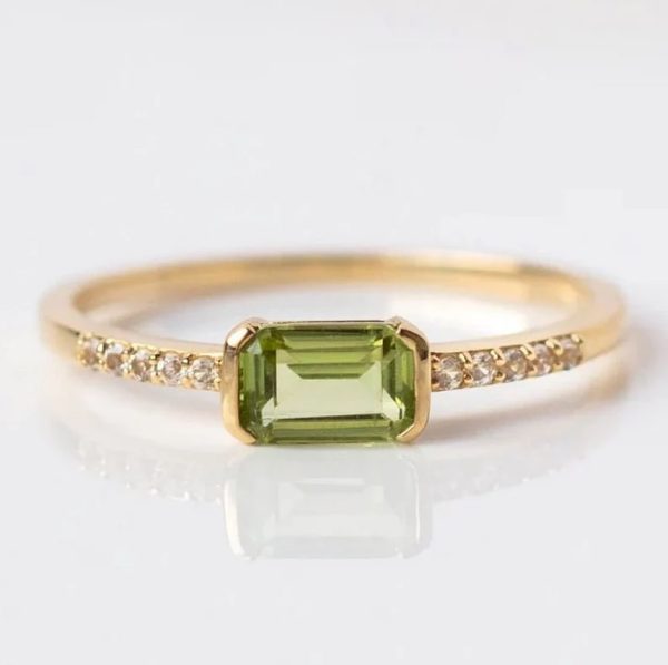 Peridot engagement ring on 18 karat gold