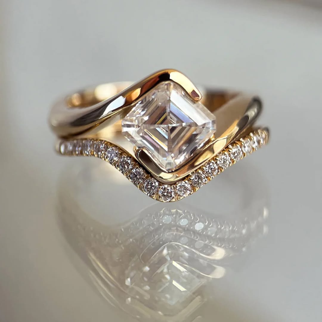2.5ct ascher cut moissanite set on 18k gold band with a wedding band