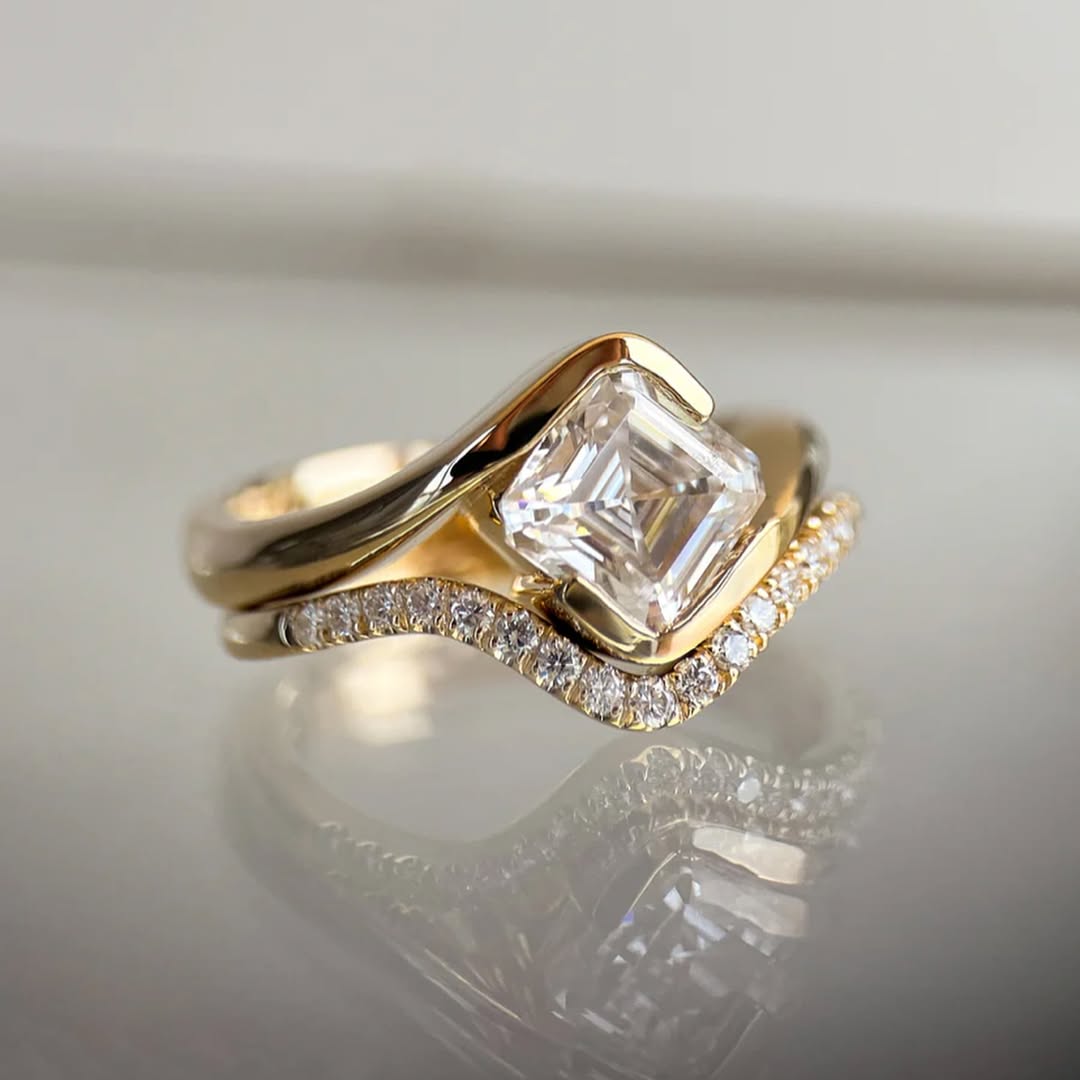 2.5ct ascher cut moissanite set on 18k gold band with a wedding band