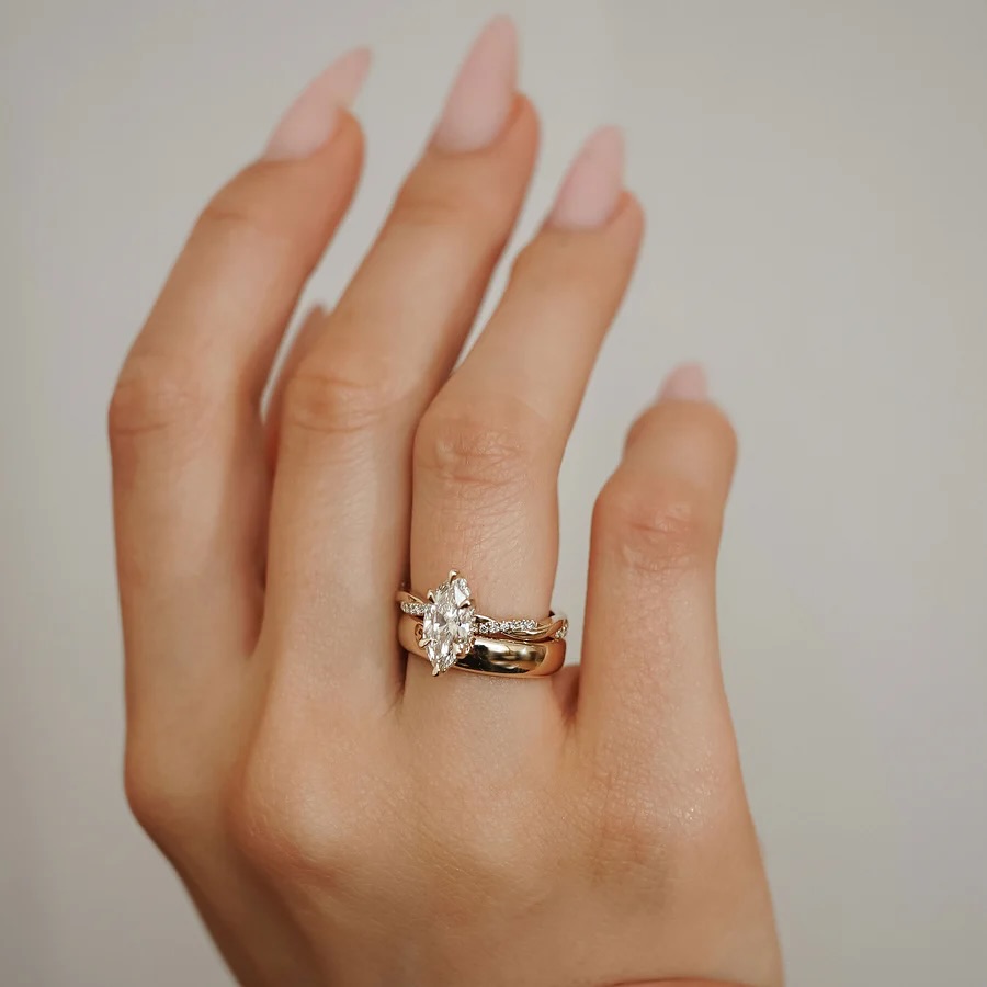 1.5 carat Marquis on 18K gold with accent diamonds Rope design