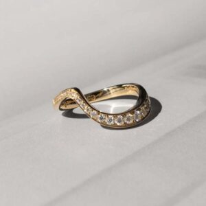 Ocean pave band with ascending moissanites on 18 karat gold